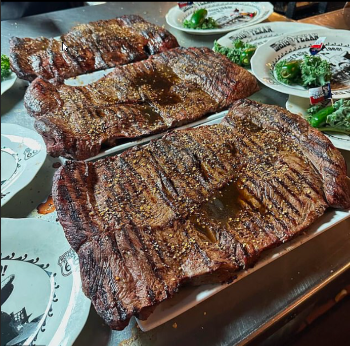 Three 72-ounce Big Texan steaks on platters